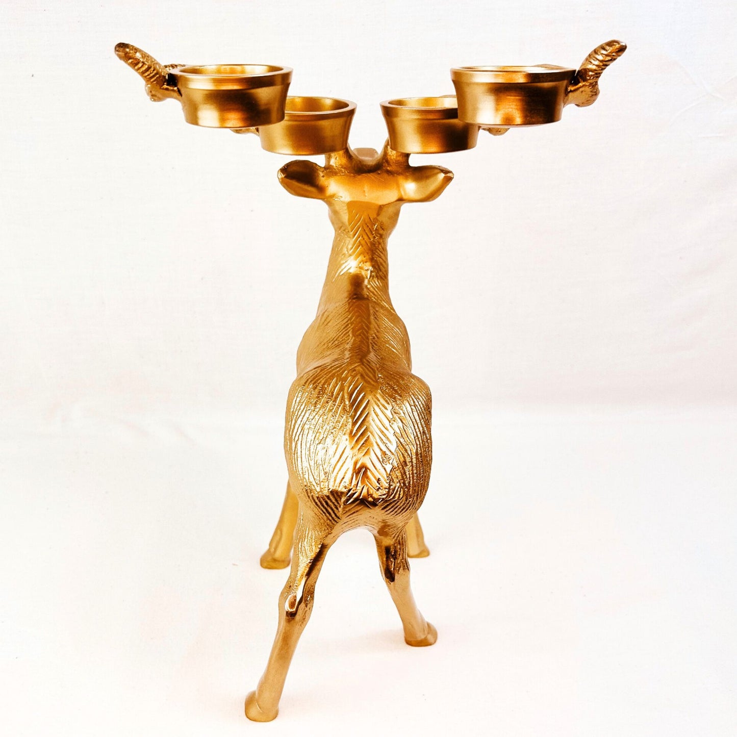 Back shot of Stag Candle Holder in Bronze finish. 4 pillar, tealight candle holder.