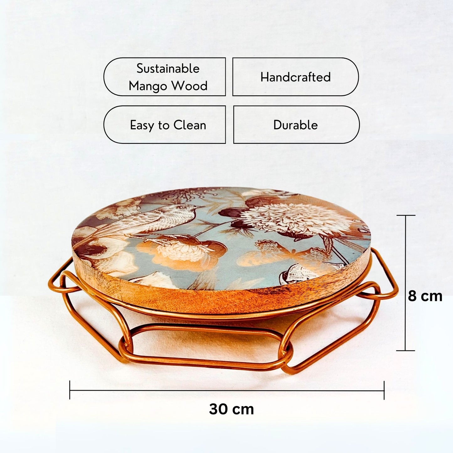 Product dimensions and USP of Cake Stand with Bird and flower print on a blue backdrop. The stand has an interlinked chain design in brushed gold.