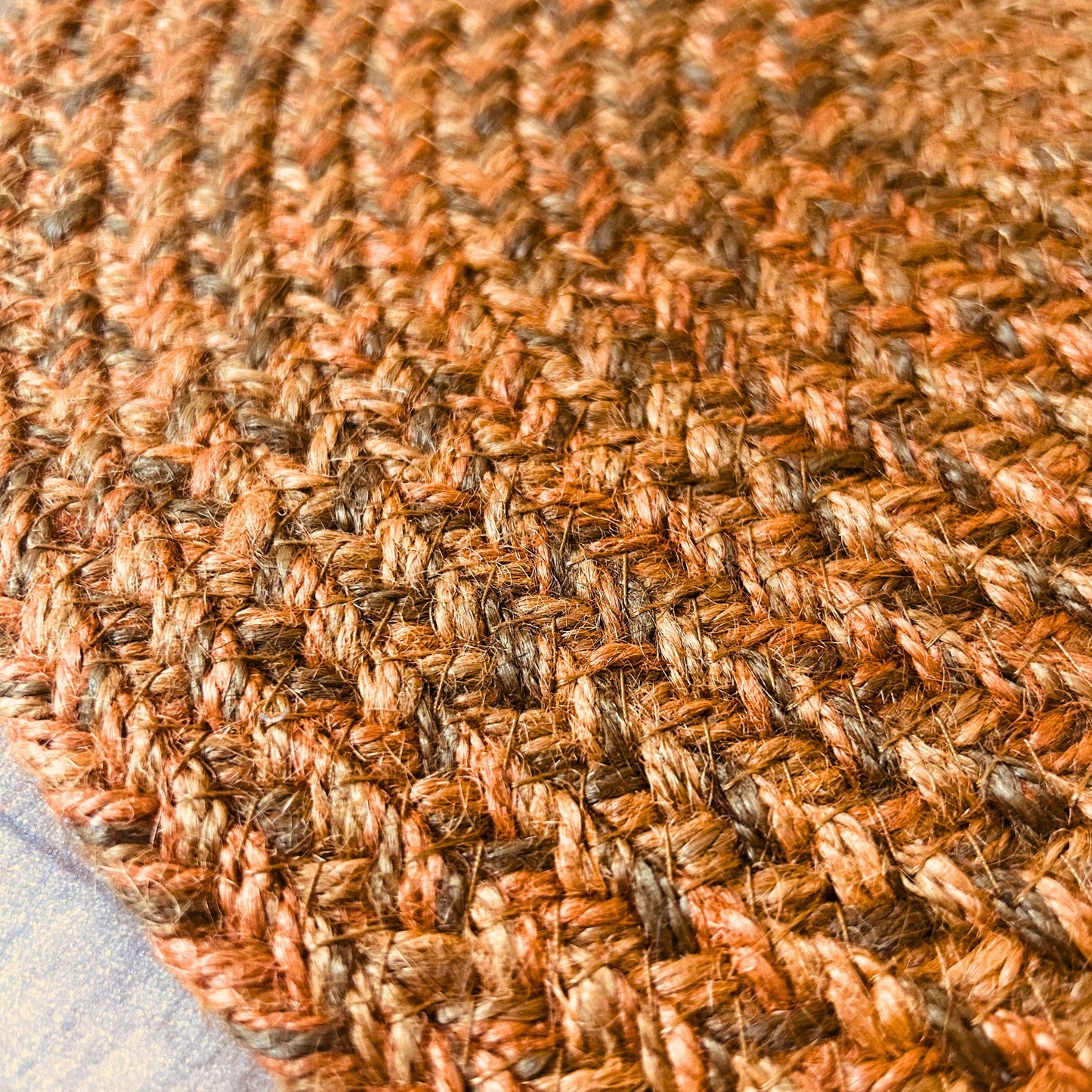 Close up texture of a 100% Jute placemat placed on a wooden backdrop