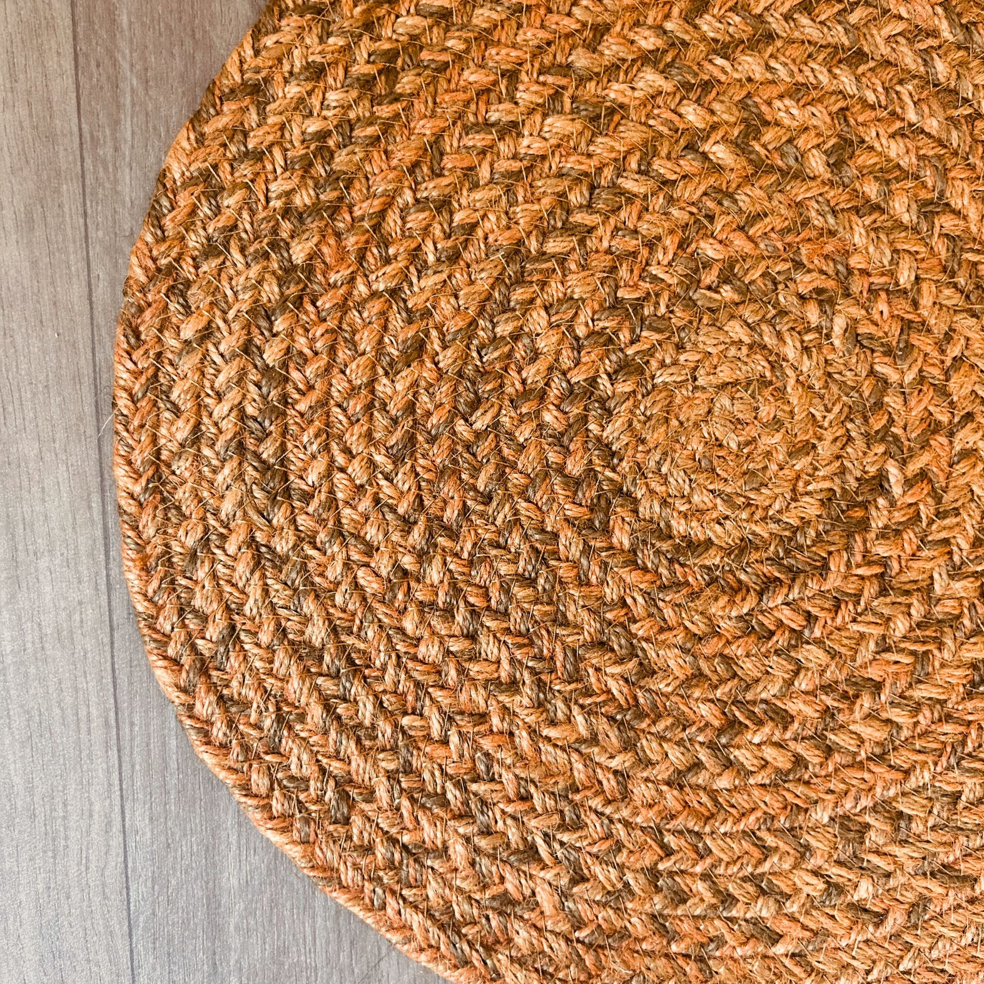 Close up of a 100% Jute placemat placed on a wooden backdrop