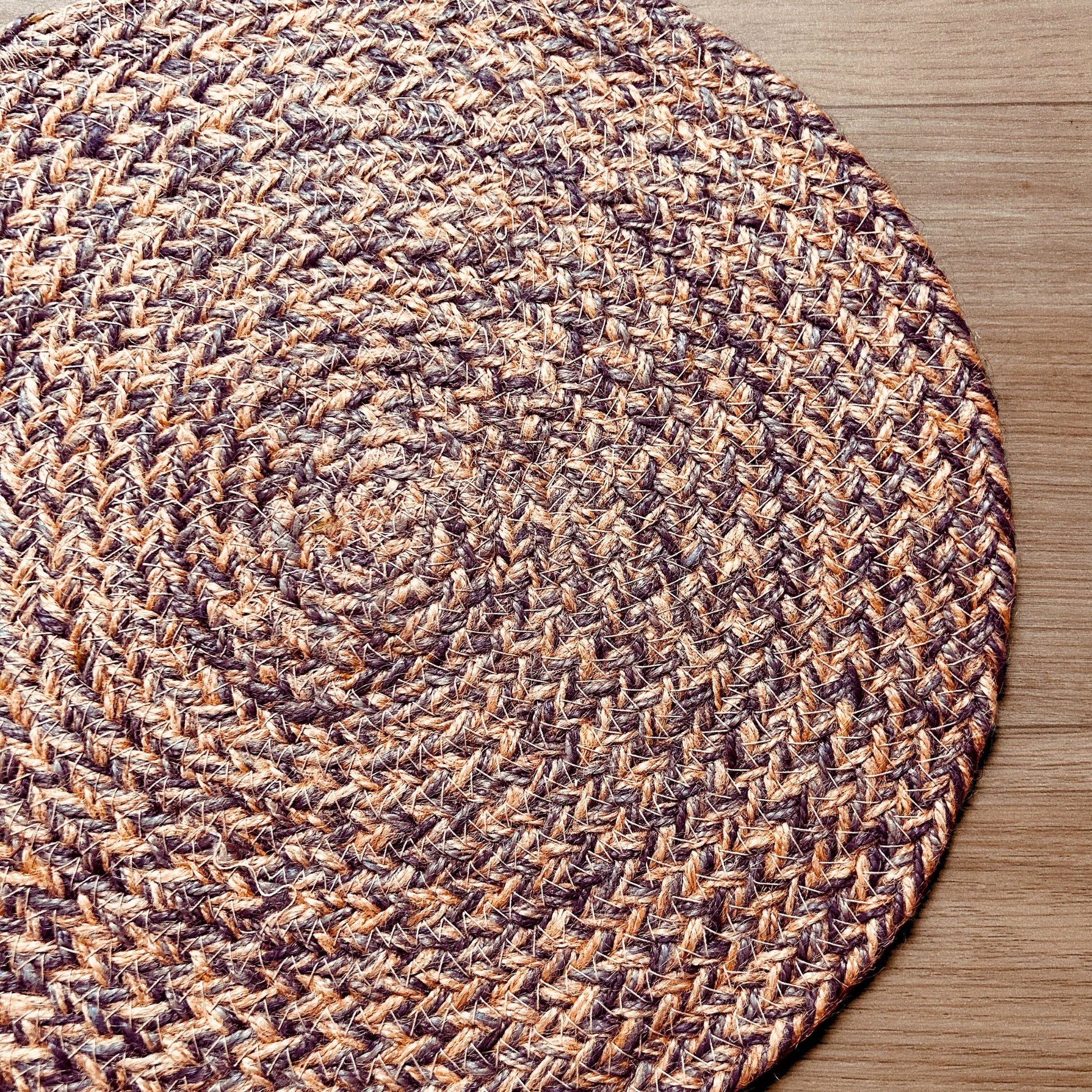 Close up of a 100% Jute placemat placed on a wooden backdrop