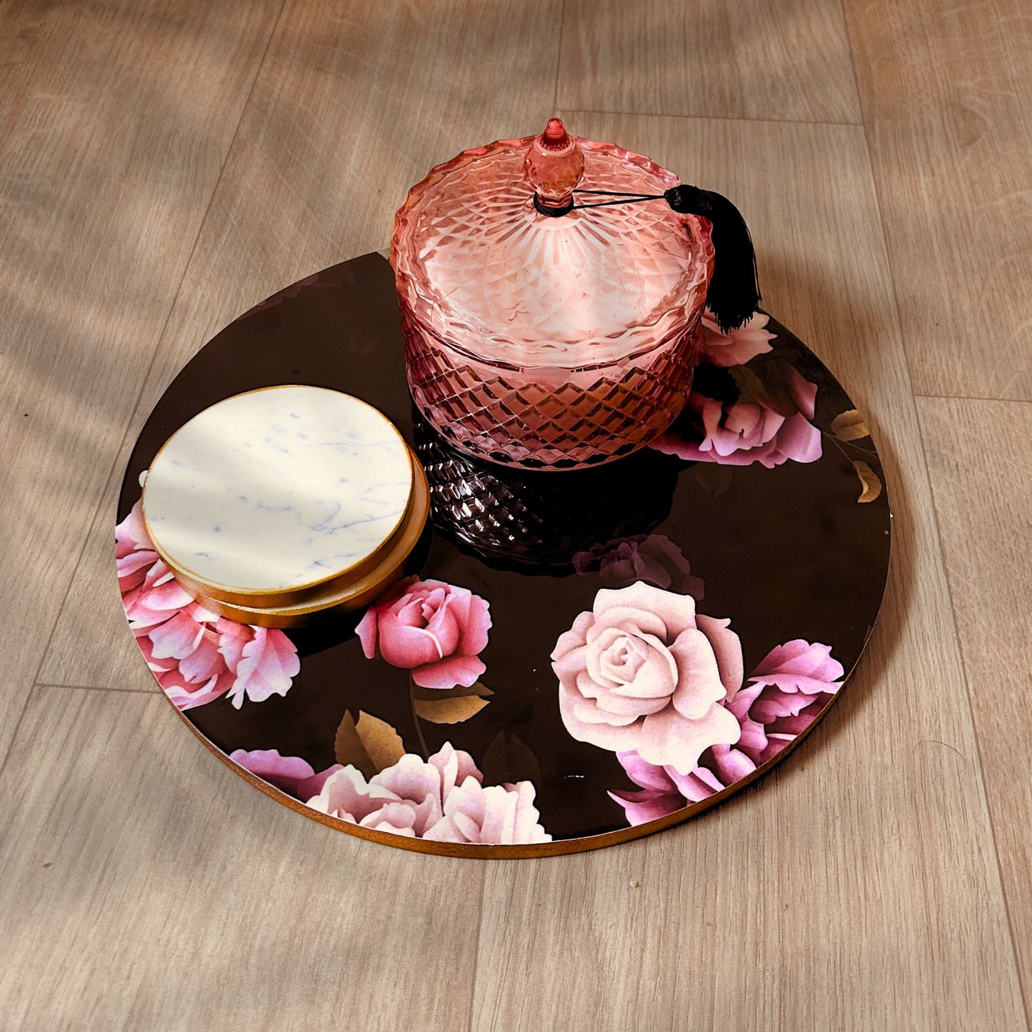 English Roses printed Decorative Tray or Placemat placed on a wooden backdrop. Ithas white marble coasters and a candle kept on it.