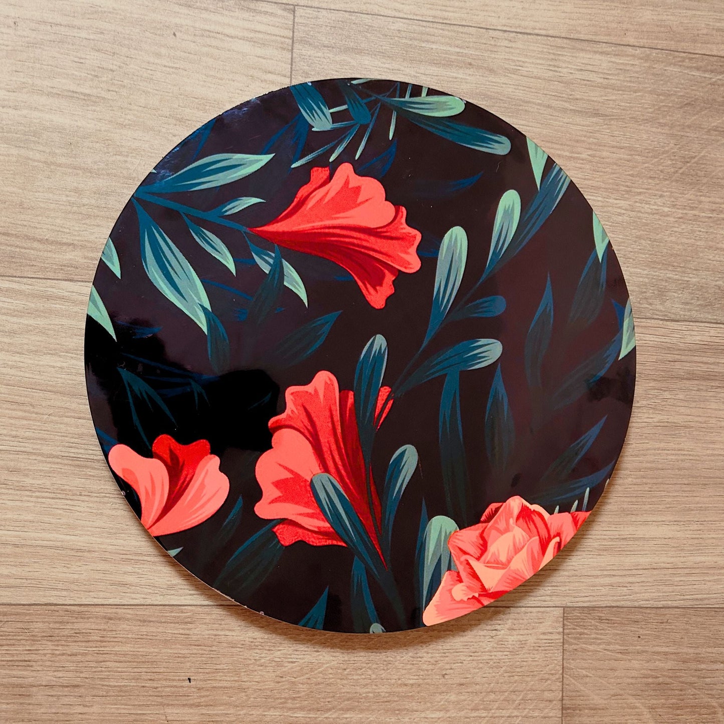 Floral printed Decorative Tray or Placemat placed on a wooden backdrop.