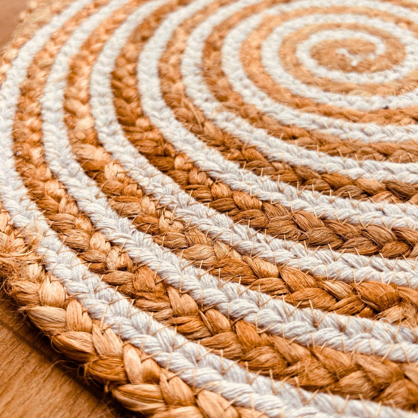 Close Up 100% Natural Round Jute and Cotton Braided Placemat in brown and white stripes showing the texture.