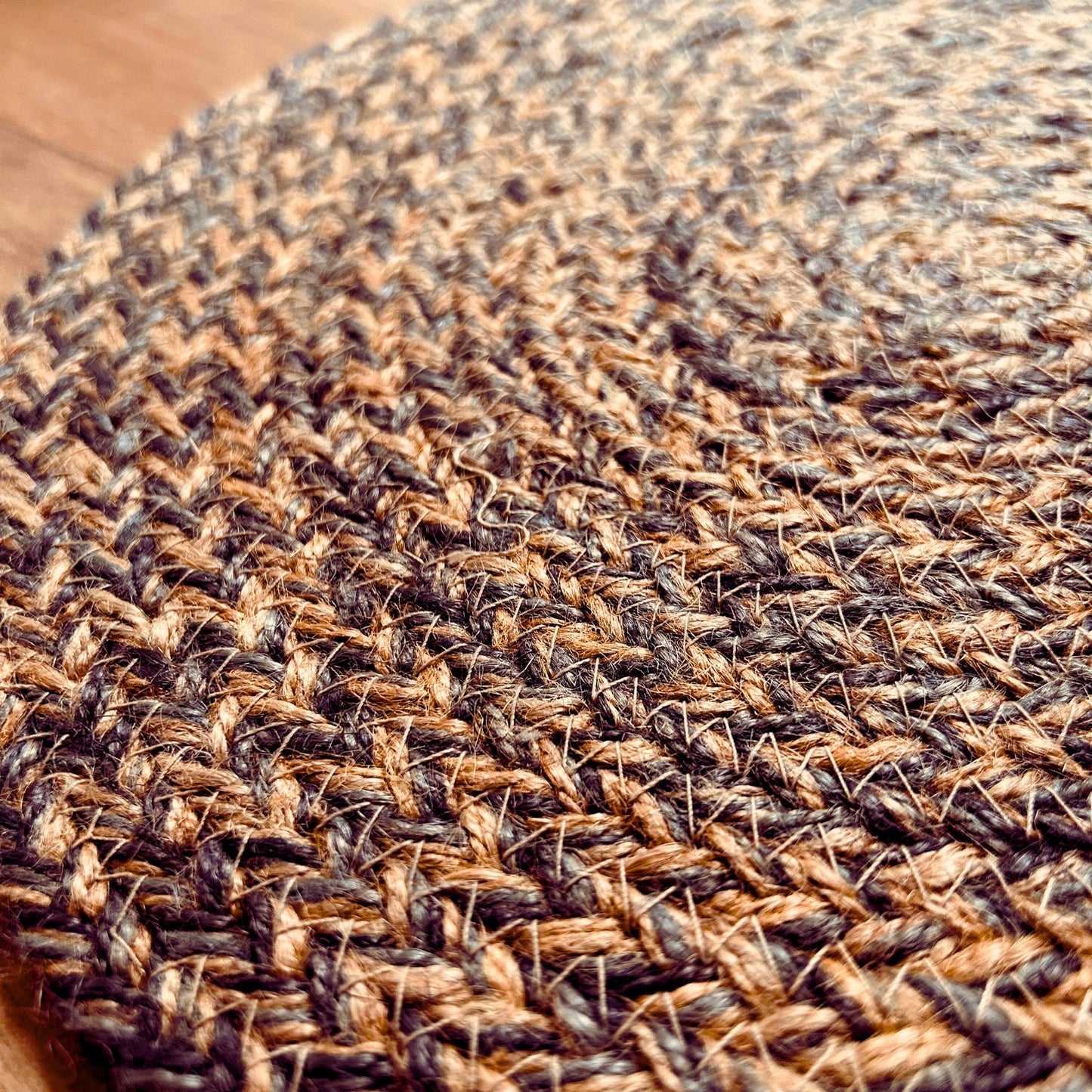 Close up texture of a 100% Jute placemat placed on a wooden backdrop