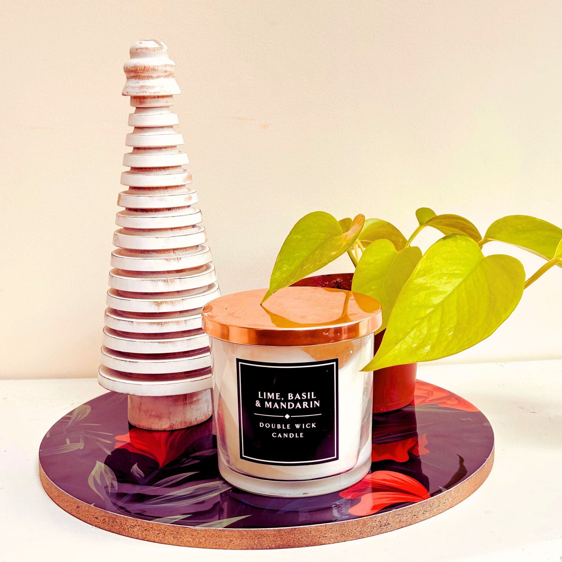 Floral printed Decorative Tray with a wooden tree, candle and plant placed on top.