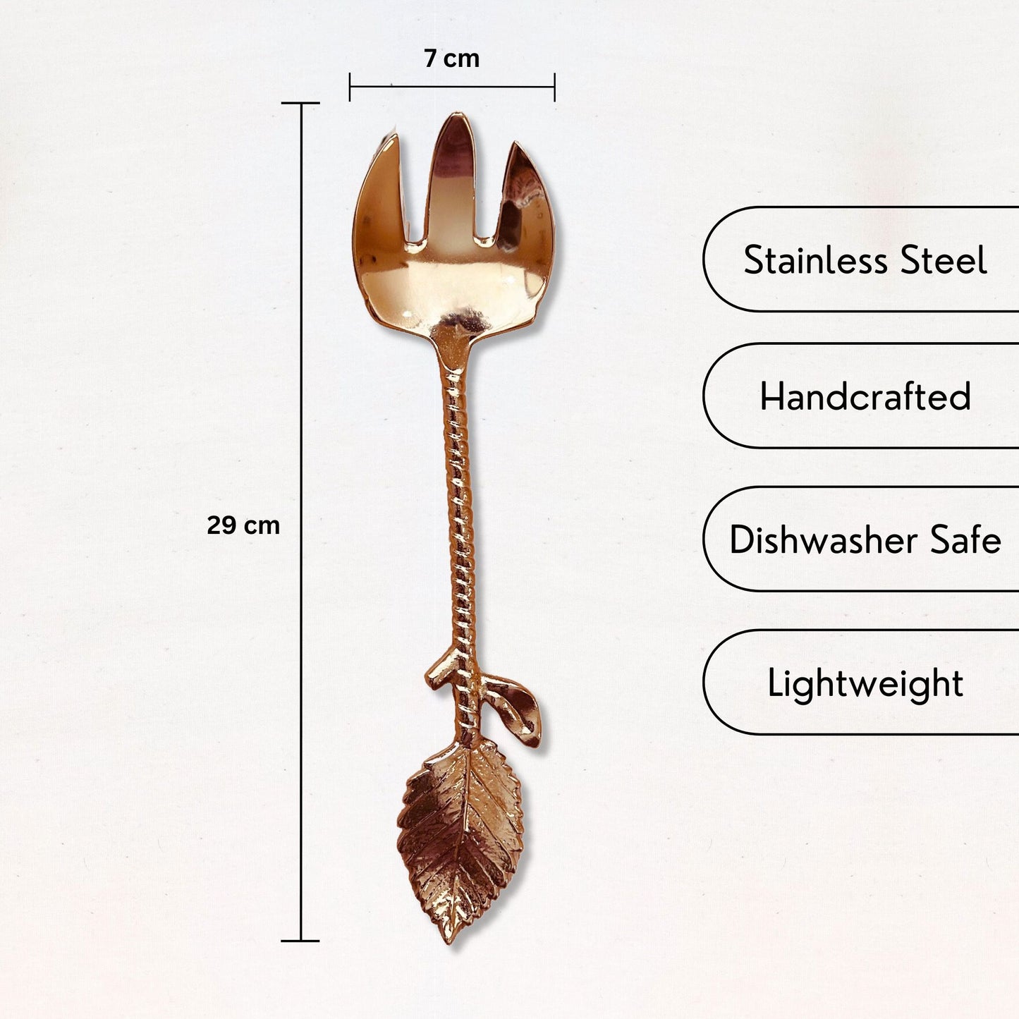 USP and dimensions of a Gold Finish Stainless Steel Salad Serving Fork with a twine and leaf handle. It is kept on a white backdrop.