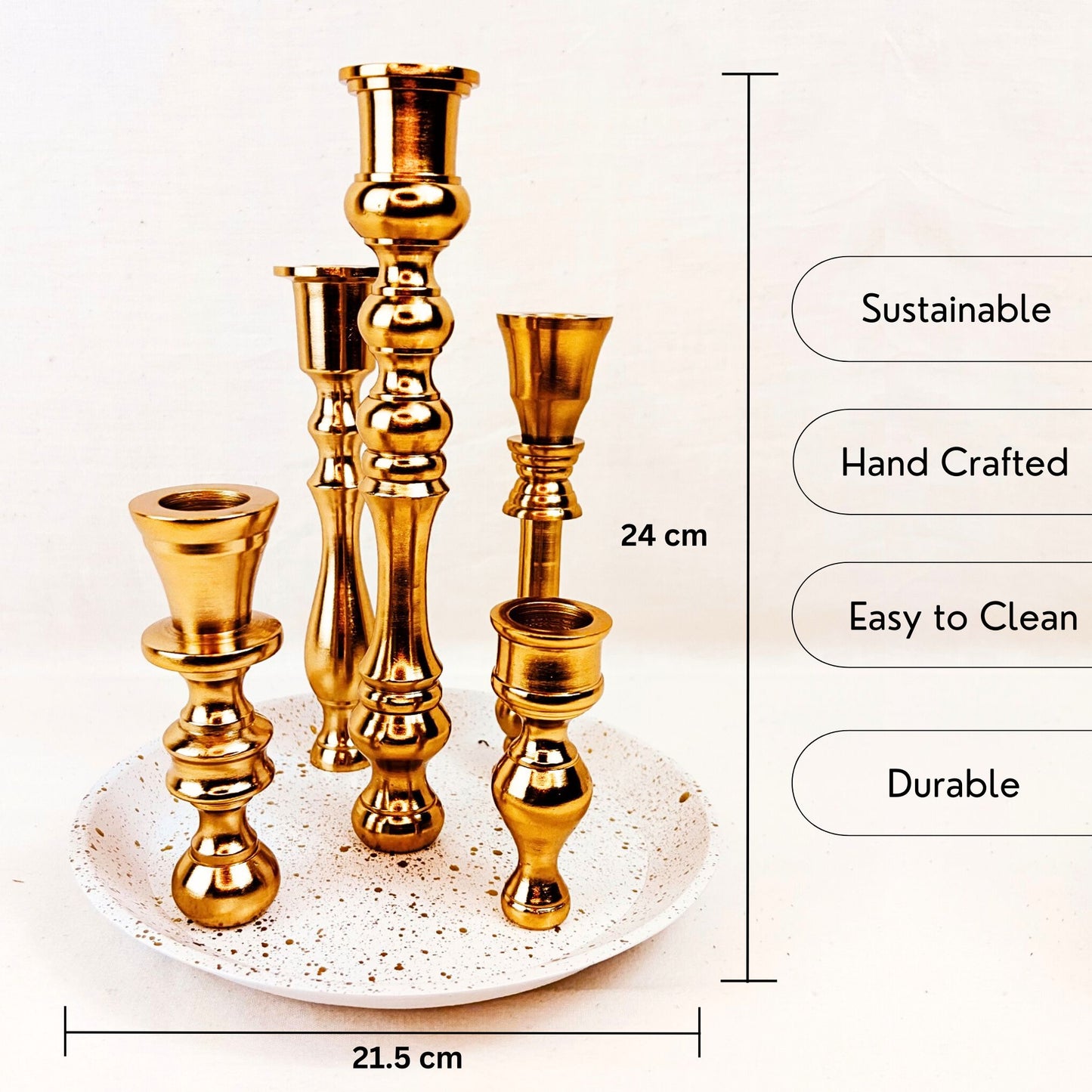 The USP and dimensions of a 5 candle holder candelabra with a brass finish. The base is white with specks of gold on it.