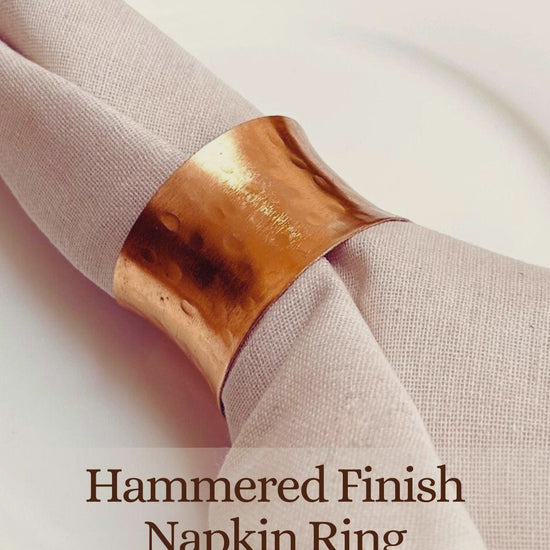 Product Overview of a Gold Hammered Finish Napkin Ring.