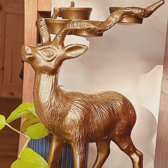 Product preview video of a Stag Candle Holder in Bronze finish. 4 pillar, tealight candle holder.