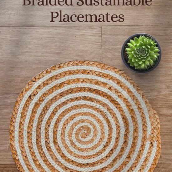 Product showcase of a 100% Natural Round Jute and Cotton Braided Placemat in brown and white stripes.