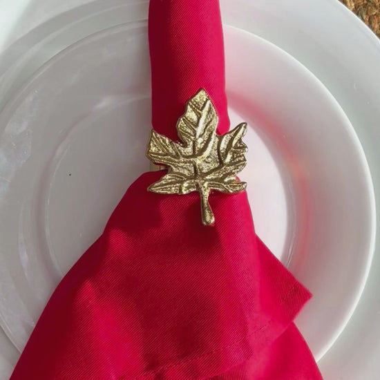 Product showcase of a Gold finish Leaf design Napkin Ring.